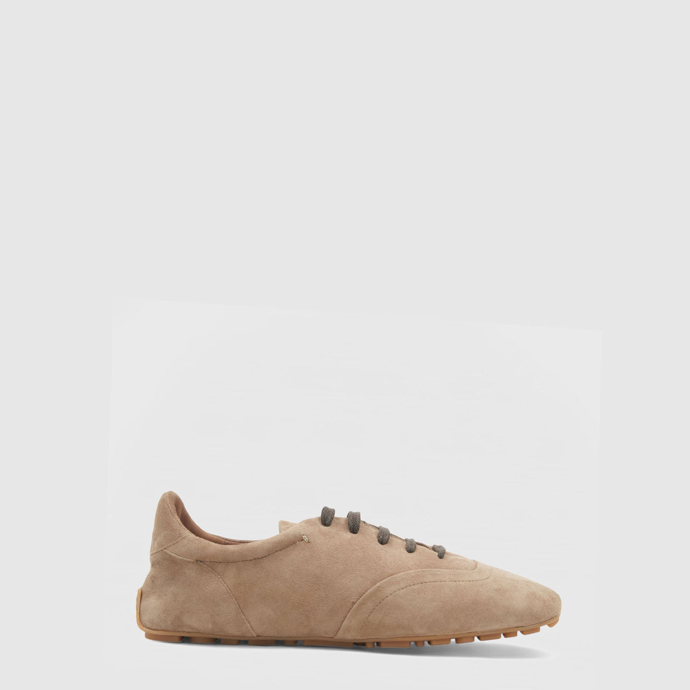 Beige sneaker on a light gray background